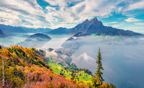 Captivating morning view of outskirts of Stansstad town, Switzerland, Europe. Impressive autumn scene of Lucerne lake. Majestic landscape of Swiss Alps. Traveling concept background.