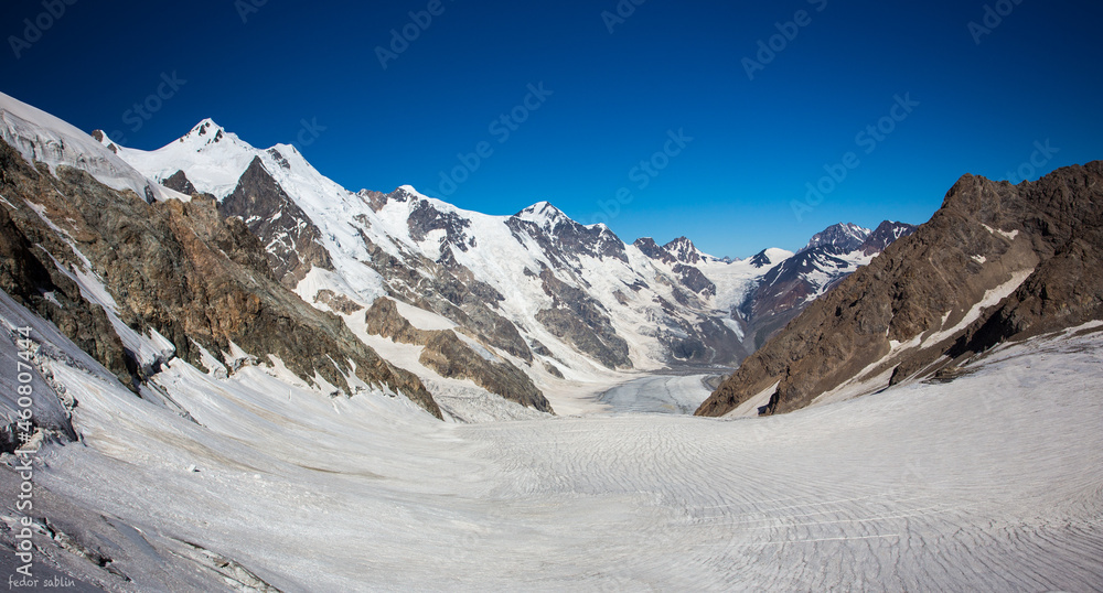 Snow covered mountains with glacier between Snow covered mountains with glacier between