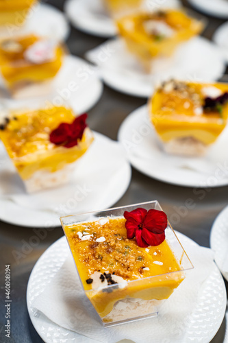 Catering. kremenki with fruit desserts decorated with flowers.  photo