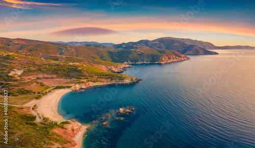 Beautiful summer scenery. Colorfuul view from flying drone of Cheromylos beach. Splendid sunrise on Euboea island, Greece. Great Aegean seascape. Beauty of nature concept background.