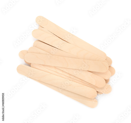 Disposable wooden spatulas for depilatory wax on white background, top view © New Africa