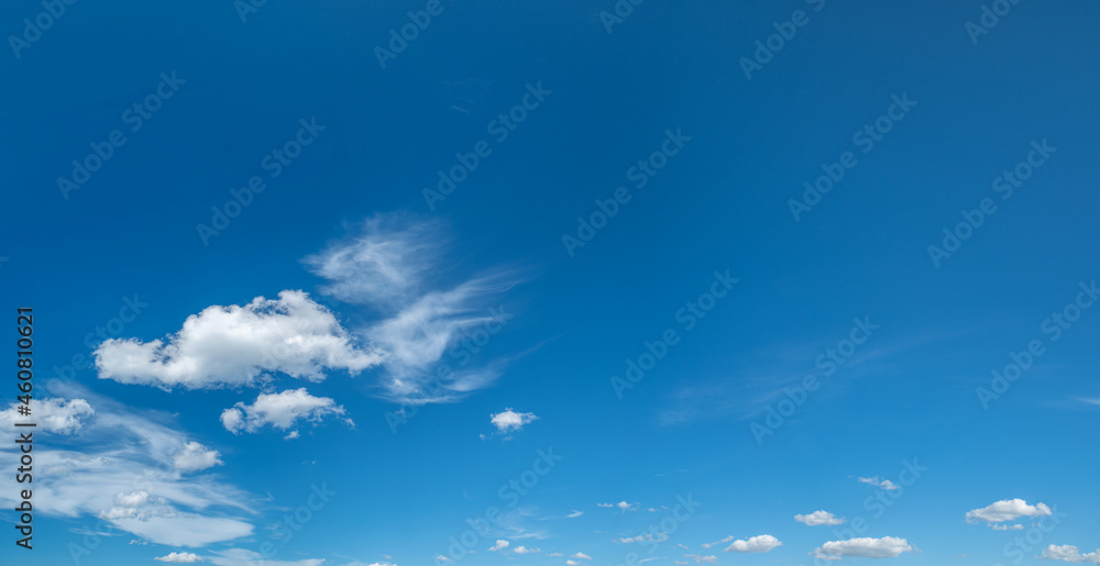 Obraz premium Deep blue sky and white different types of clouds in it. Beautiful nature background.