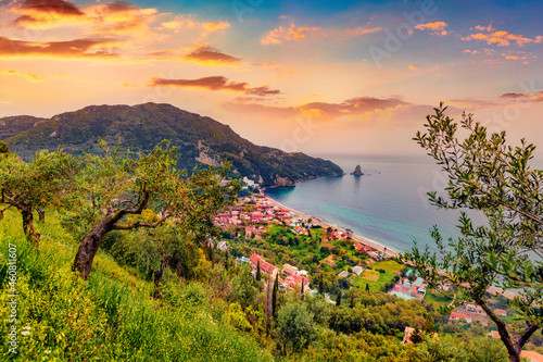 Fototapeta Naklejka Na Ścianę i Meble -  Attractive summer cityscape of Agios Gordios village, Achilleio municipality. Wonderful morning seascape of Ionian Sea. Impressive landscape of Corfu island, Greece. Traveling concept background.
