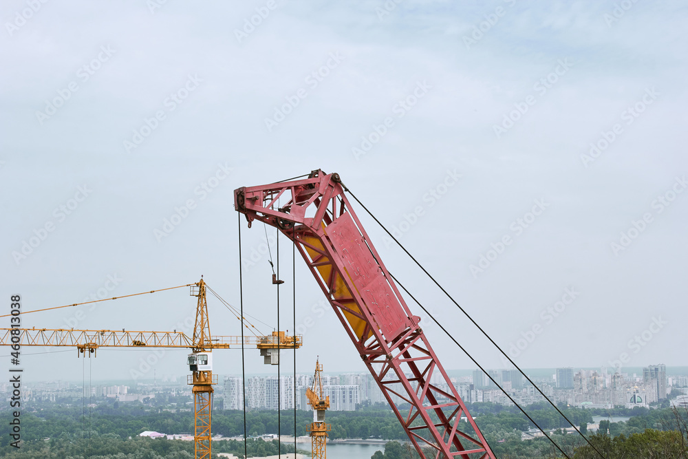 Construction cranes on the background of the city of Kyiv. Construction cranes on the background of the city of Kyiv.
