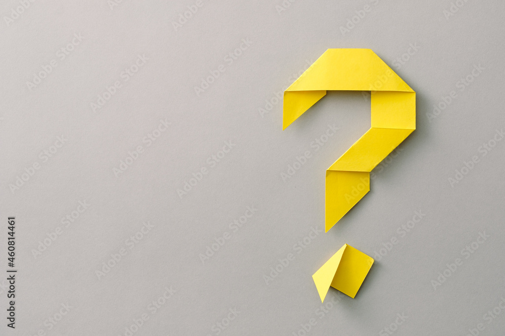 Decorative yellow paper origami question mark on grey - obrazy, fototapety, plakaty 