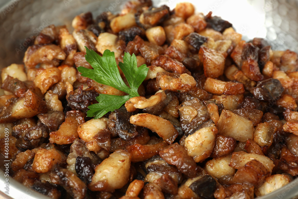 Tasty cooked cracklings in frying pan, closeup. Pork lard Tasty cooked cracklings in frying pan, closeup. Pork lard