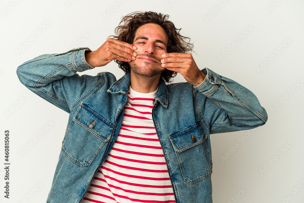 Young caucasian man isolated on white background doubting between two options. Young caucasian man isolated on white background doubting between two options.
