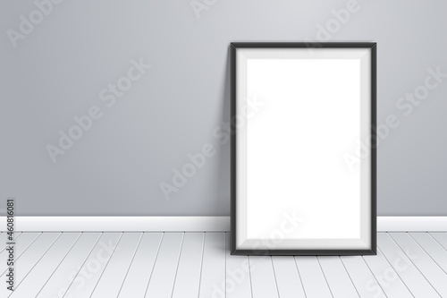 Minimalist mockup template on wall. Black picture frame stand on wooden floor in room. Template for photography presentation. Empty board photoframe