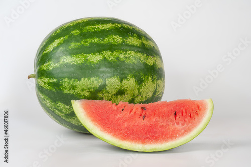 ripe watermelons on a white background and on melons