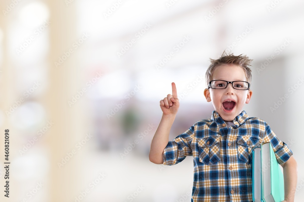 Cheerful happy little kid smiling and and looking at camera Cheerful happy little kid smiling and and looking at camera