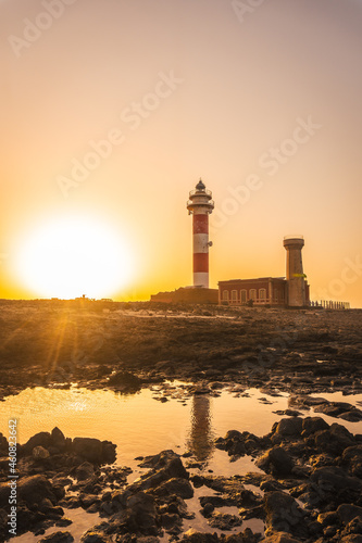 Sunset at the Toston Lighthouse, Punta Ballena near the town of El Cotillo, Fuerteventura island, Canary Islands. Spain