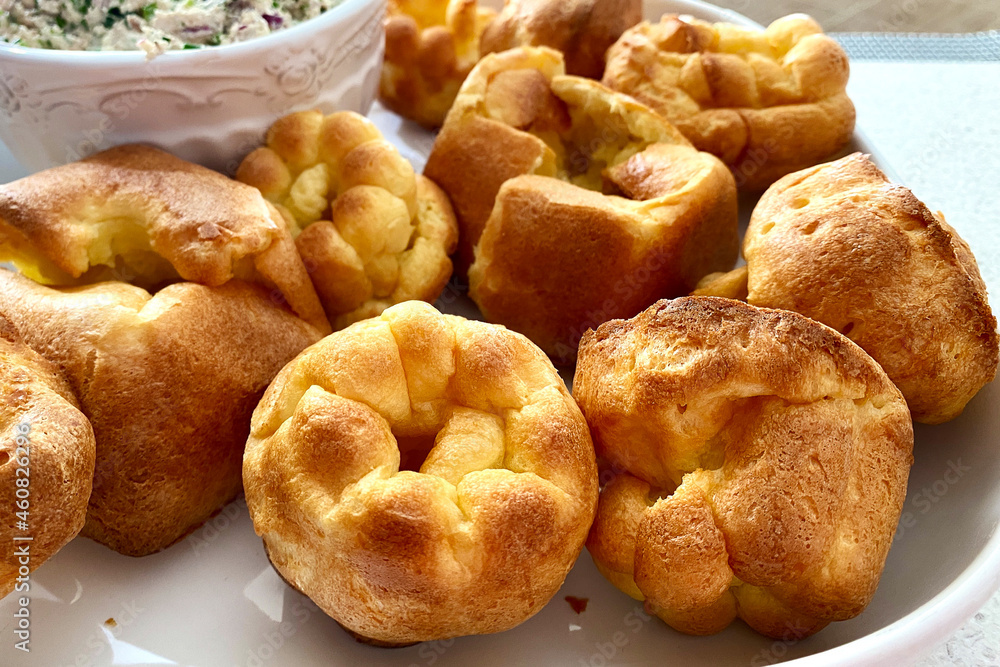 PopoversFresh popover muffins are served on a white platter. Yorkshire pudding