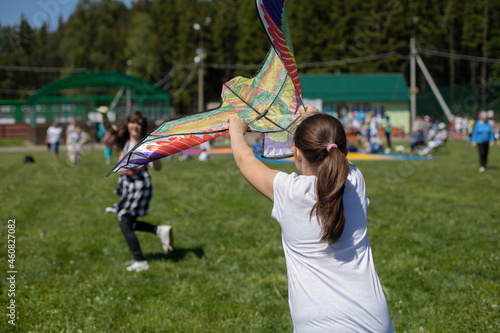 Children fly a kite.