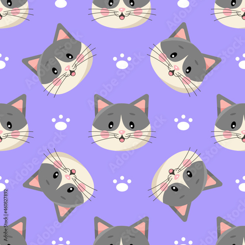 Seamless pattern with cute cartoon cats and paws isolated on violet background