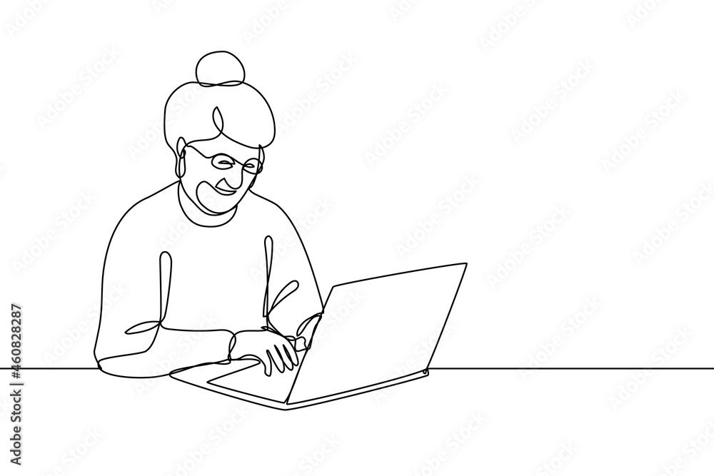 Smiling elderly woman working on laptop Smiling elderly woman working on laptop