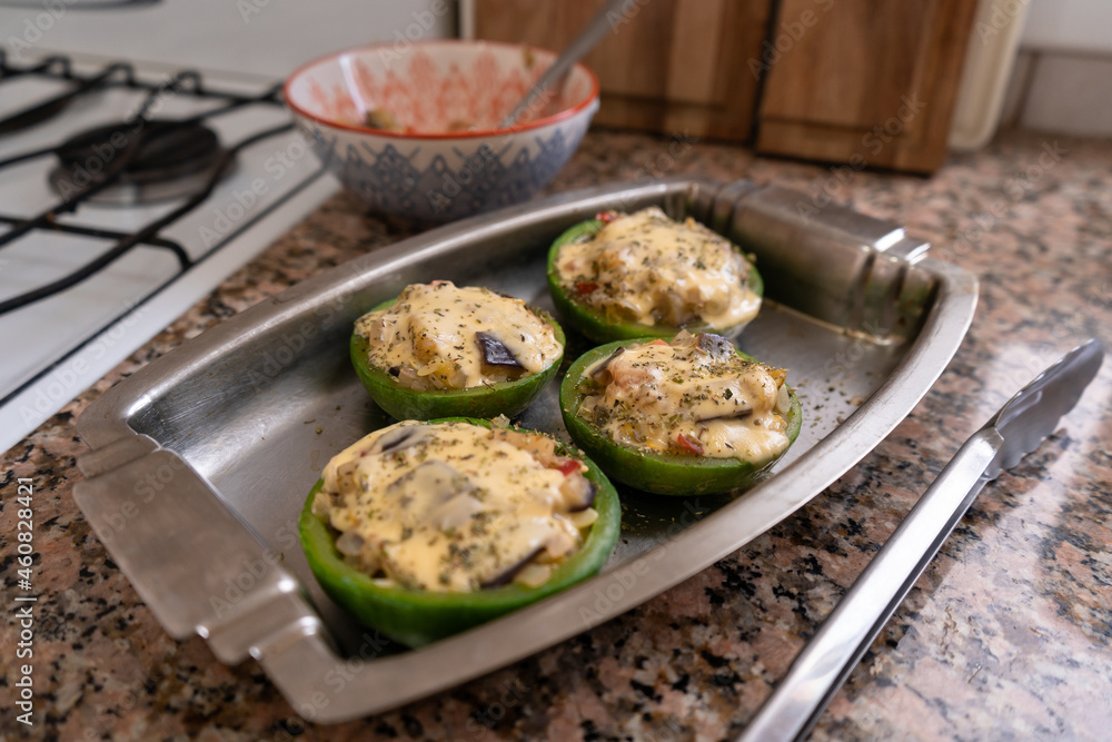 Small round zucchini stuffed with vegetables and cheese