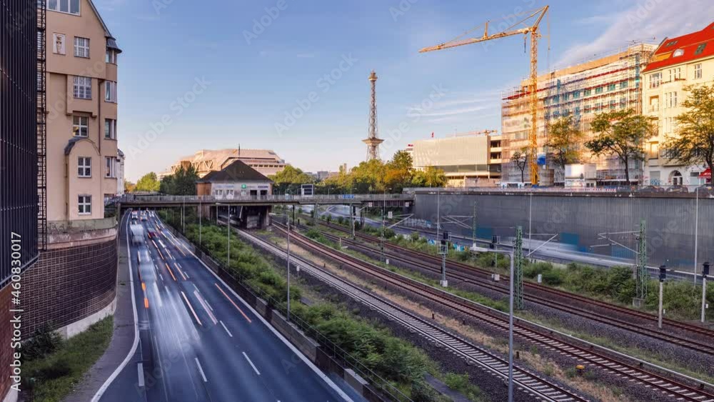 Day Time lapse of fast moving highway traffic showing cars and trains, Berlin, Germany Day Time lapse of fast moving highway traffic showing cars and trains, Berlin, Germany