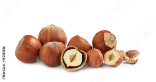 Photos Tasty organic hazelnuts on white background. Healthy snack