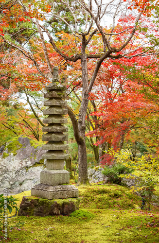 Stone Pagoda in Arashiyama, Kyoto, Japan in Autumn season photo