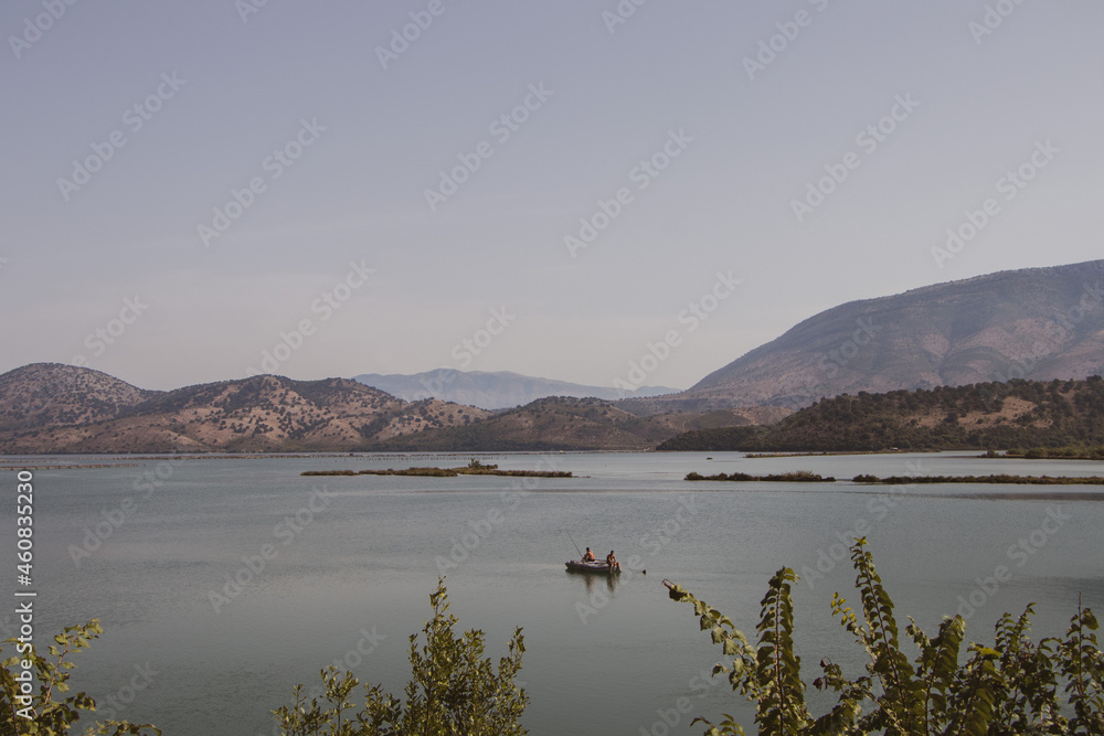 Butrint National Park, Albania. Archaeological open-air museum. Ancient city. Men are fishing in the lake