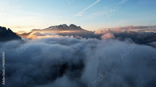 Mountains in the clouds at sunrise. Italian Dolomites