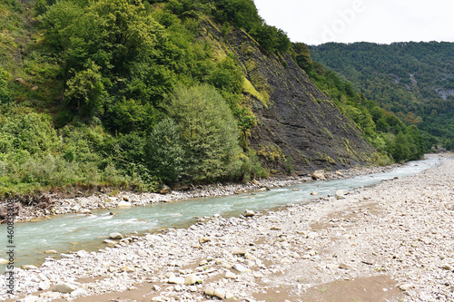 Rapid mountain river in a gorge in Western Caucasus.