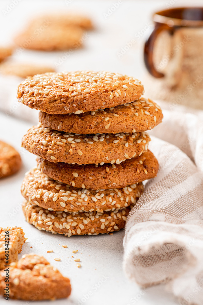 Homemade oatmeal cookies with sesame seeds close-up. Tasty sweet breakfast, healthy food. Homemade oatmeal cookies with sesame seeds close-up. Tasty sweet breakfast, healthy food.