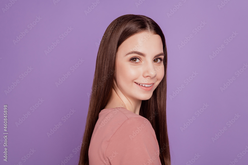 Turned photo of positive young girl happy smiling isolated over violet background Turned photo of positive young girl happy smiling isolated over violet background
