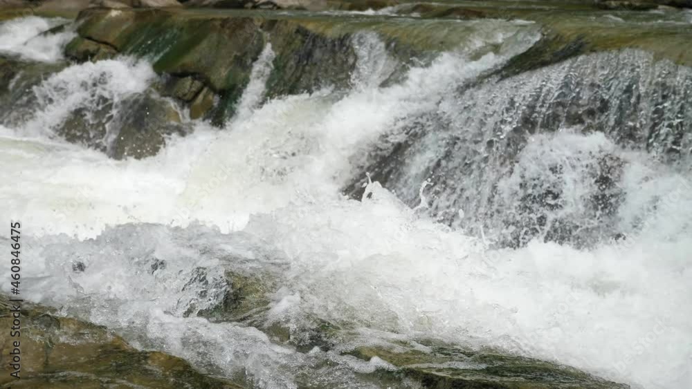Mighty clean waters overcoming rocky waterfall in the Carpathian mountains Mighty clean waters overcoming rocky waterfall in the Carpathian mountains