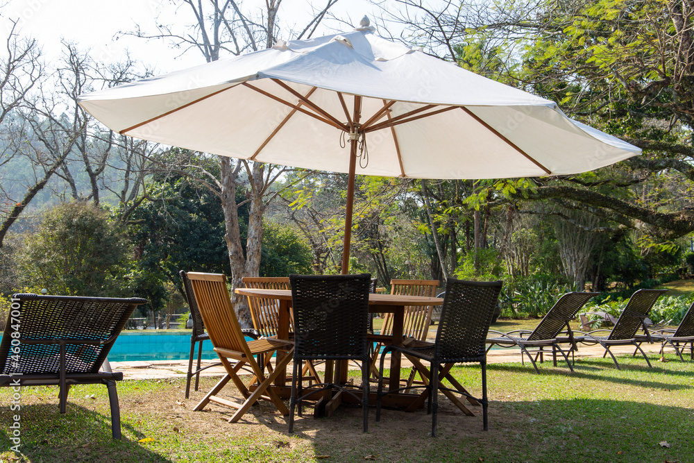 Beautiful pool with chairs in the sun on a farm in Brazil. Beautiful pool with chairs in the sun on a farm in Brazil.