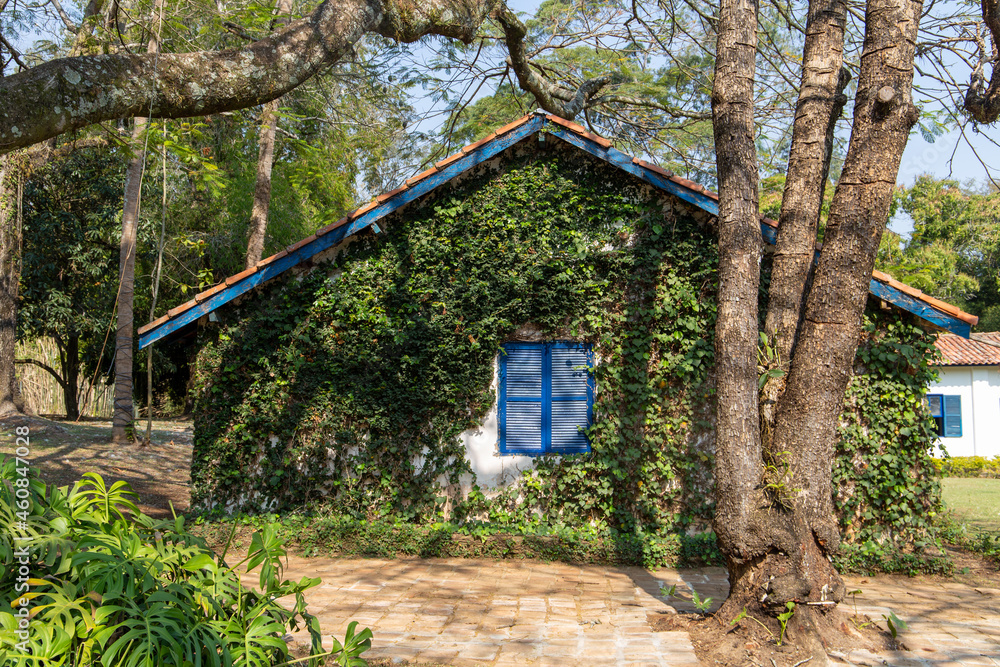 old colonial house on a historic farm in São Paulo, Brazil. Blue wooden windows. old colonial house on a historic farm in São Paulo, Brazil. Blue wooden windows.