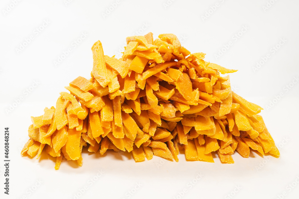 Dry tasty mango slices as a background. Dry tasty mango slices as a background.