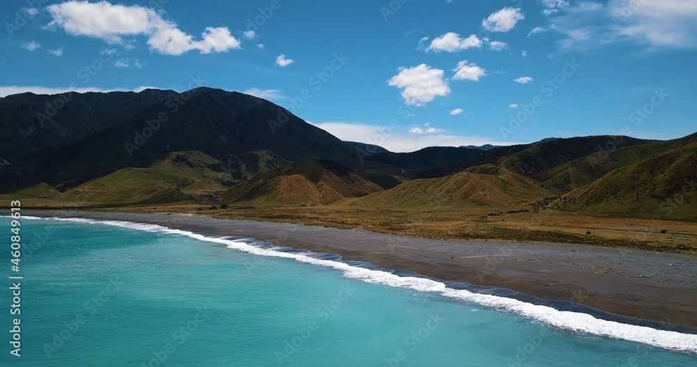 Aerial of beautiful remote Pacific coastal beach in Summer - New Zealand Aerial of beautiful remote Pacific coastal beach in Summer - New Zealand