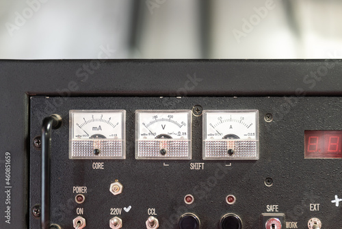 Electricity current and voltage monitering gauge on engine or power generator control panel. Industrial equipment object photo. Close-up and selective focus. photo