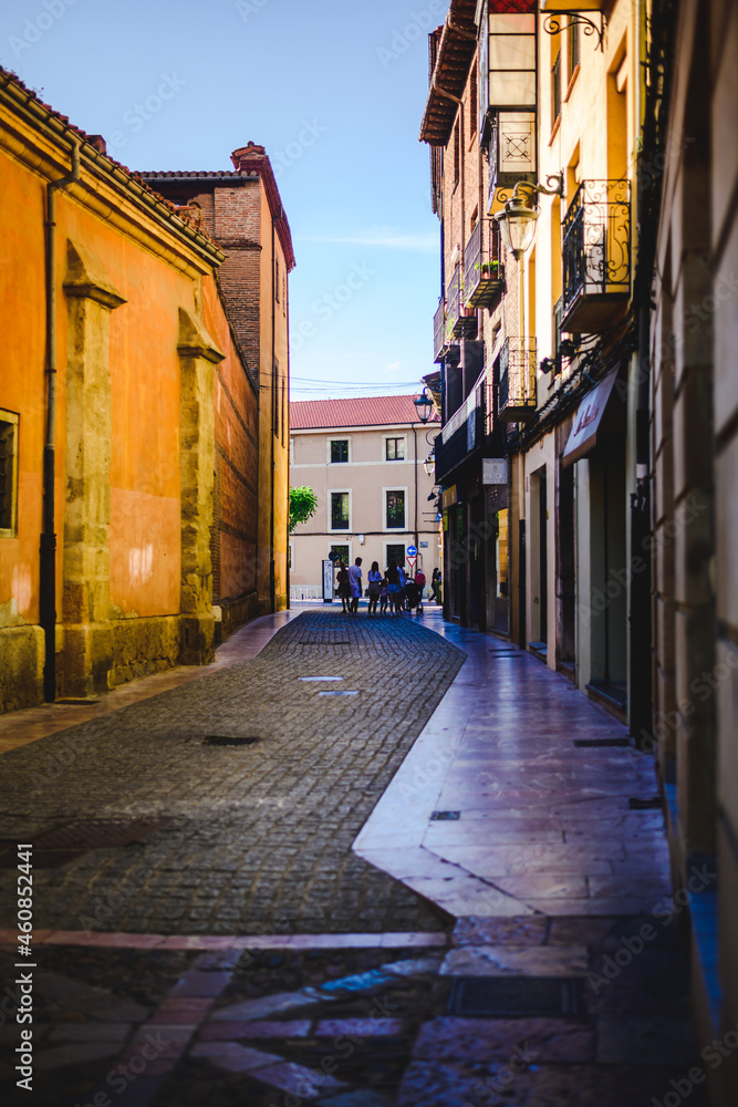 old street of a historic city with the orange tones of the sunset