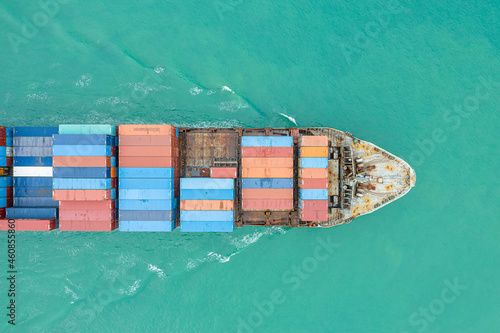 Aerial top view of cargo ship carrying container for import export goods to customer,concept logistic and supply chain