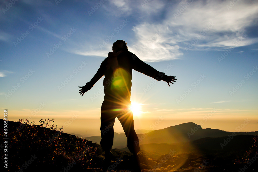 Fototapeta premium Man jumping on sunrise scene, famous mountain in north of Thailand