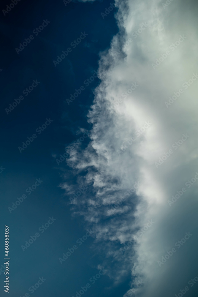 Naklejka premium Cumulus white clouds floating on blue sky.