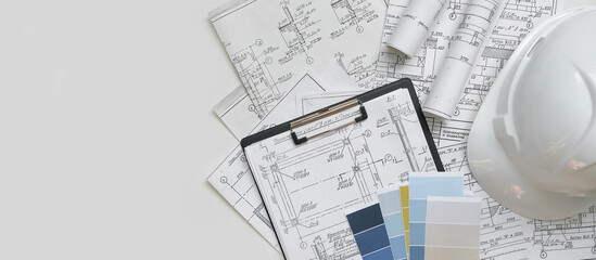 Architect works remotely from home in quarantine, lockdown covid 19 coronavirus. Remote work, stay home, new normality, social distance. Architect design working drawing sketch plans blueprints