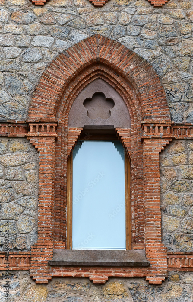 Old brick window in an old building in the Cantabria region of Spain.