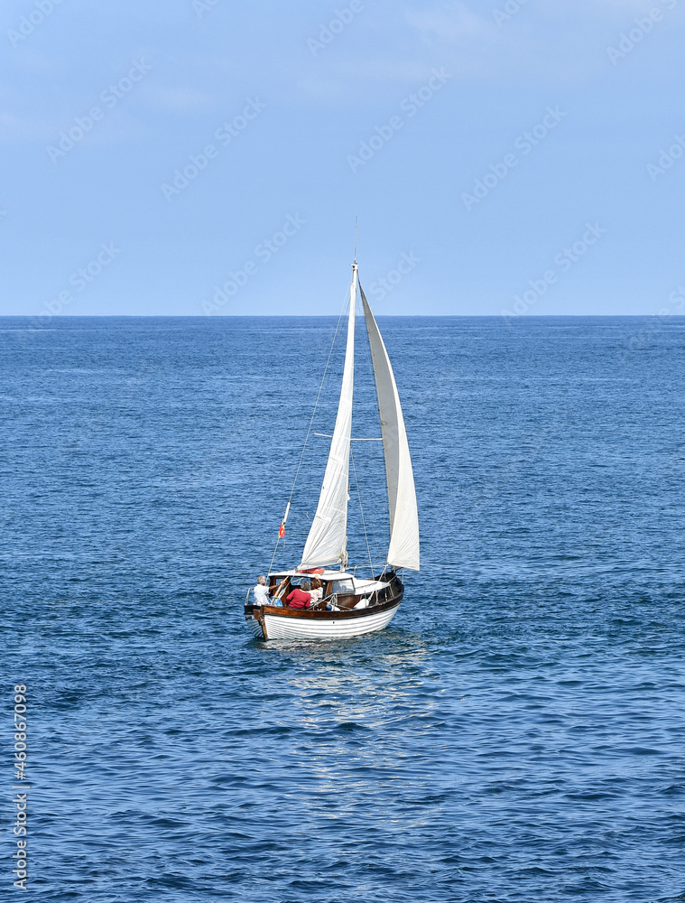 Fototapeta premium Old wooden sailboat off Santander in Spain, sailing on the Atlantic Ocean.