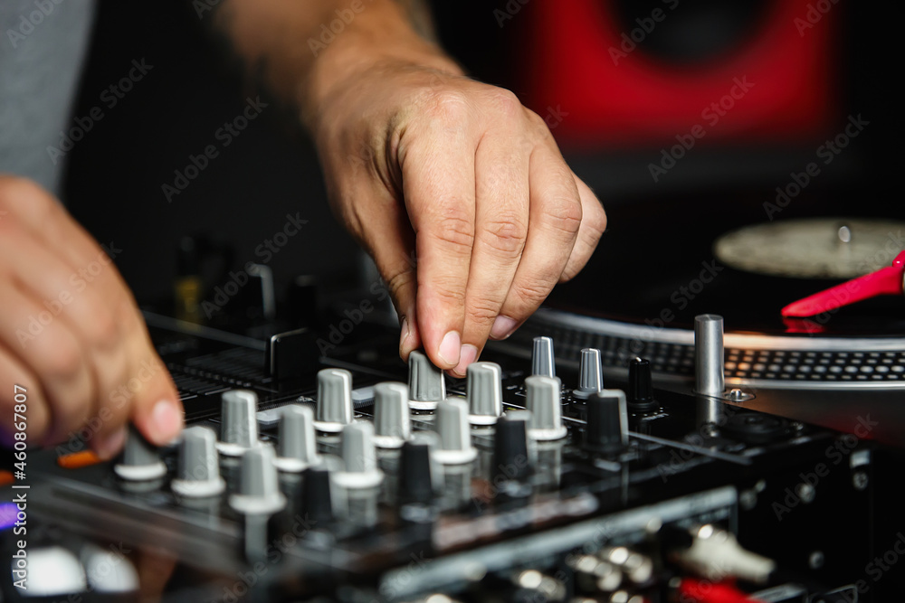 Disc jockey mixing music. Dj audio equipment on hip hop party in night club. 