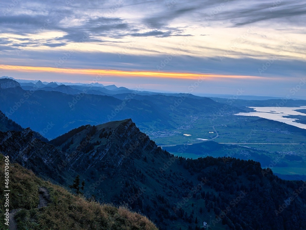 Fototapeta premium evening mood on the speer mountain in toggenburg. view to lake Zurich, Rapperswil. sunset, wanderlust, switzerland