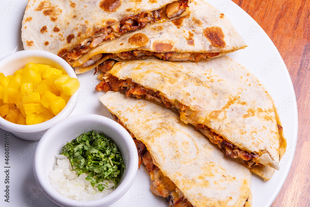 Shepherd's meat tacos with corn tortillas. Gringa with cheese. Mexican food on wooden background. Mexican gringa with hot sauce. Mexican taco concept. Mexican food concept. Shepherd's meat tacos with corn tortillas. Gringa with cheese. Mexican food on wooden background. Mexican gringa with hot sauce. Mexican taco concept. Mexican food concept.