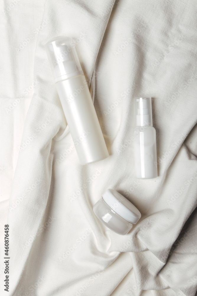 Natural cosmetic bottles on a light background Natural cosmetic bottles on a light background