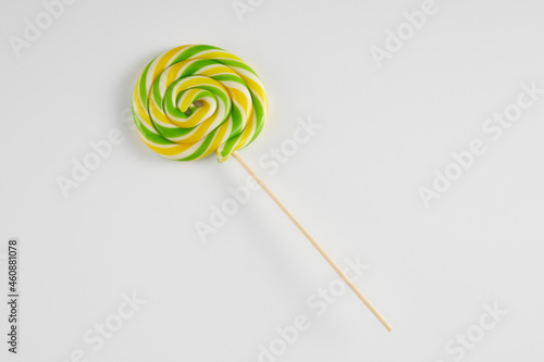 Bright coloured lollipop against a white background.