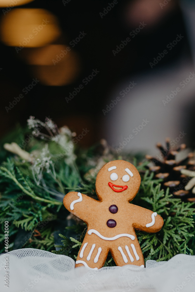 Fototapeta premium Festive Christmas composition of gingerbread cookies in the shape of a man. Background for your greeting cards with space for your text