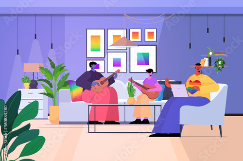 gay family playing guitar with son fatherhood transgender love LGBT community concept living room interior