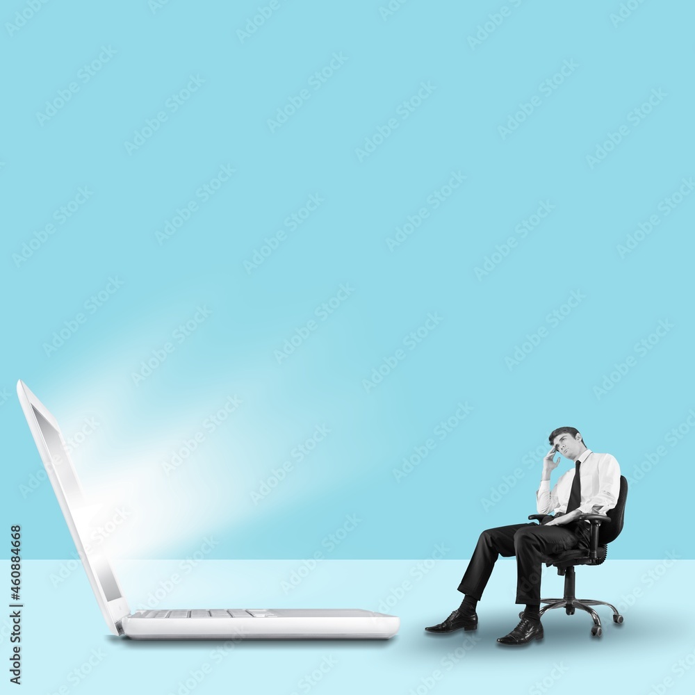 Modern design, contemporary art collage. Small businessman and a laptop Modern design, contemporary art collage. Small businessman and a laptop