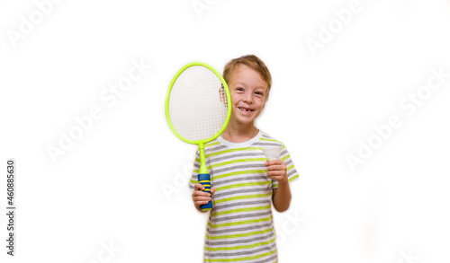 Boy holding a racket and shuttlecock on a white background. The child plays badminton. Children health sport concept
